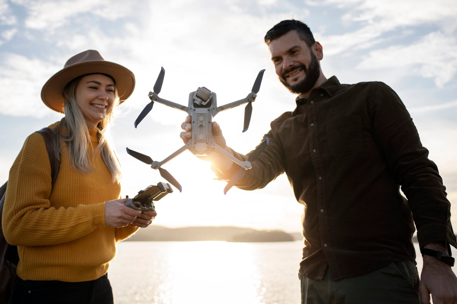 medium-shot-smiley-people-holding-drone-outdoors
